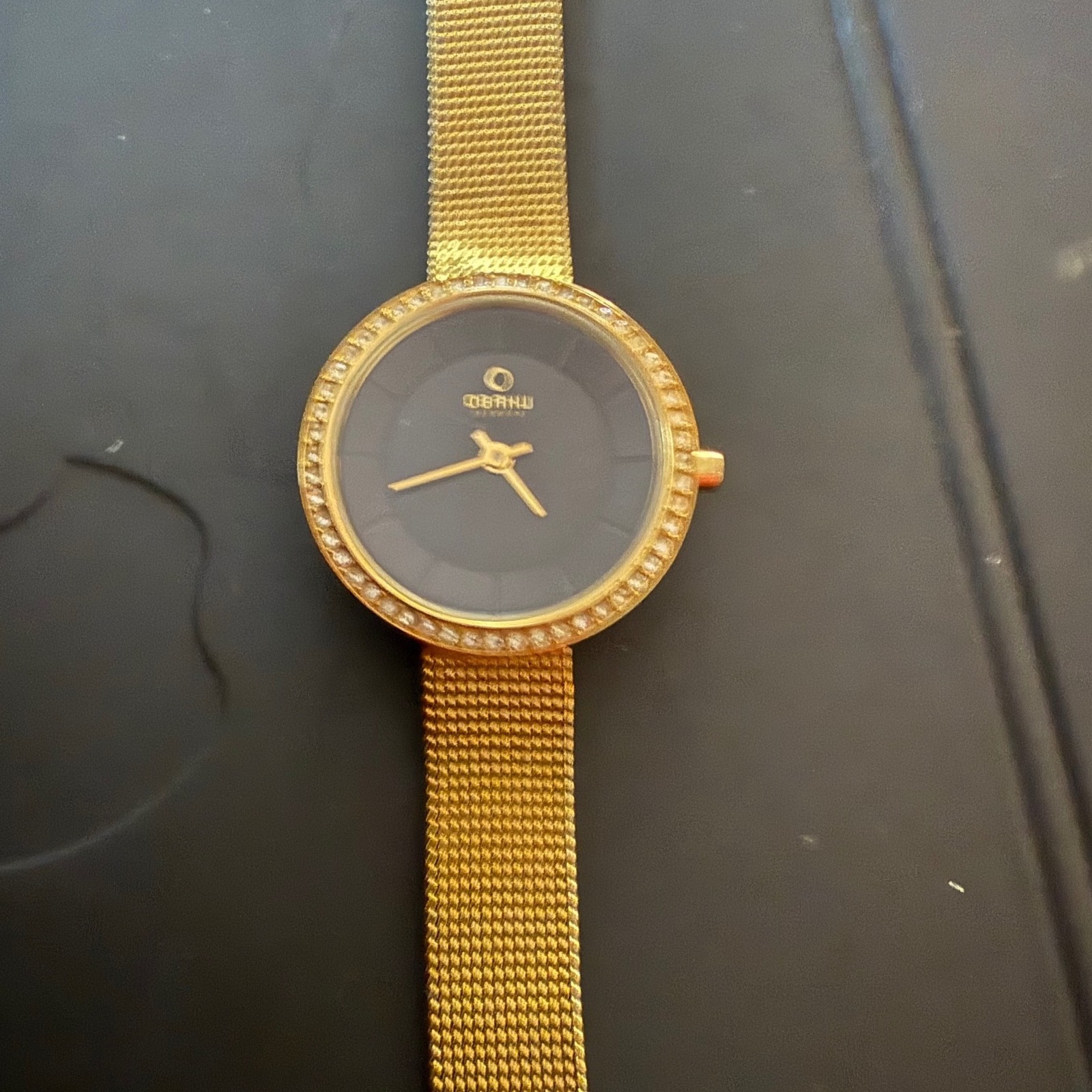 Obku Germany Womens Gold Mesh Band Crystal Bezel Black Dial Watch